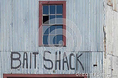 Aluminum siding and broken windows on an old new England working Stock Photo