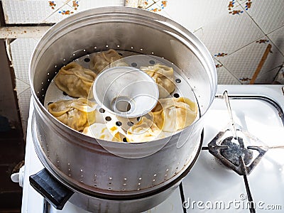 Aluminum steamer with cooking homemade manti Stock Photo