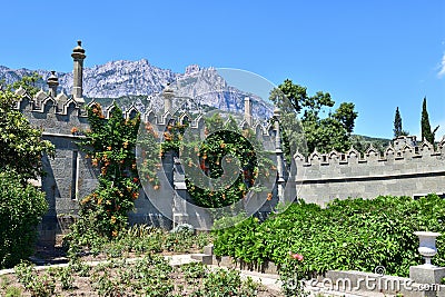 Alupka, Crimea - July 06. 2019. The wall of the Vorontsovsky Palace with a view of Mount Ai-Petri Editorial Stock Photo