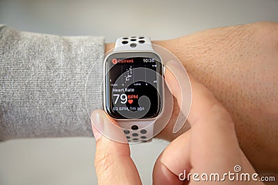 Man hand with Apple Watch Series 4 with Heart Rate Editorial Stock Photo