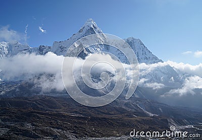 Ama Dablam 6814m clouds covered peak View near Dingboche settlement in Sagarmatha National Park, Nepal. Everest Base Camp EBC Stock Photo