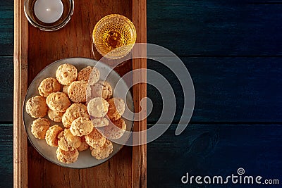 Amaretti, traditional Italian almond cookies, with a glass of Amaretto liqueur, overhead shot with a place for text Stock Photo