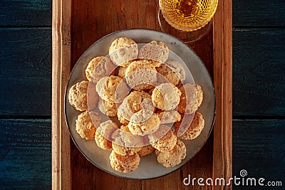 Amaretti, traditional Italian almond cookies, with a glass of Amaretto liqueur, top shot Stock Photo