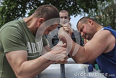 Amateur competitions on an armwrestling in the Gomel region of Belarus. Editorial Stock Photo