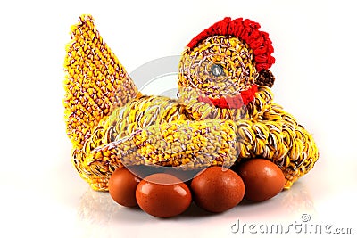 Amateur knitted hen on eggs Stock Photo