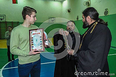 Amateur sports competitions in volleyball, the sports organizations and the Russian Orthodox Church in Gomel region of Belarus. Editorial Stock Photo