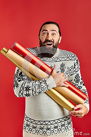 amazed bearded man in Christmas sweater Stock Photo