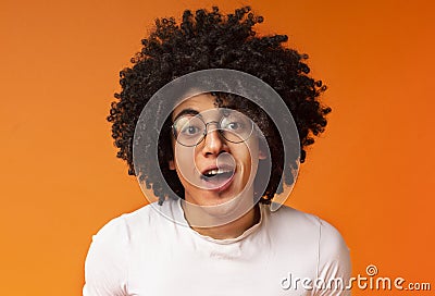 Amazed bushy black guy expressing great surprisement Stock Photo