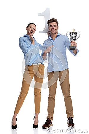 Amazed couple showing that they are the best Stock Photo