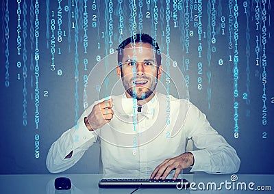 Amazed man software engineer coding using a computer and holding a cup of coffee Stock Photo