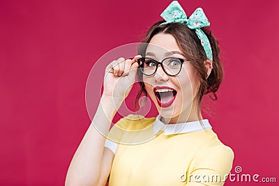 Amazed pretty pinup girl standing with mouth opened Stock Photo