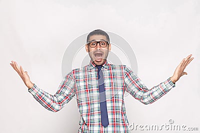 Amazed or shocked bearded businessman in checkered shirt, blue t Stock Photo