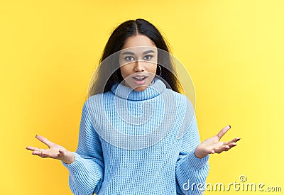 Amazed shocked black woman portrait over yellow background Stock Photo