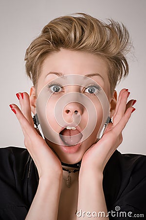 Amazed, shocked or surprised blond woman Stock Photo