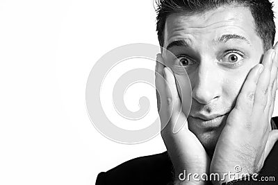 Amazed shocked surprised young man Stock Photo