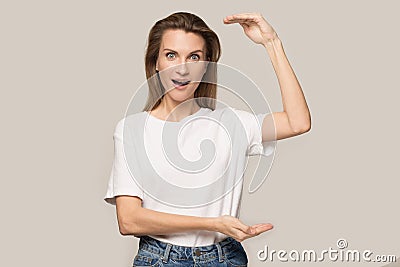 Amazed woman feel amazed by large scale measurement Stock Photo