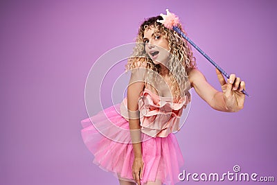 amazed woman in pink tooth fairy Stock Photo