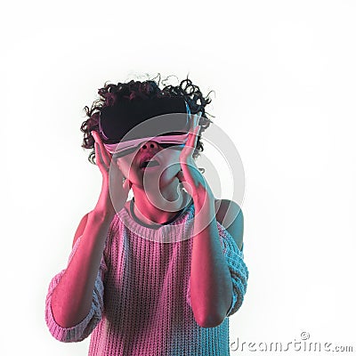 Amazed woman in VR glasses Stock Photo