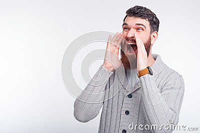 Young man is shouting some good news or promotion. Stock Photo