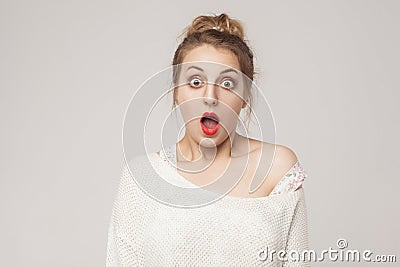 Amazement blonde open mouth and scream with surprised face. Stock Photo