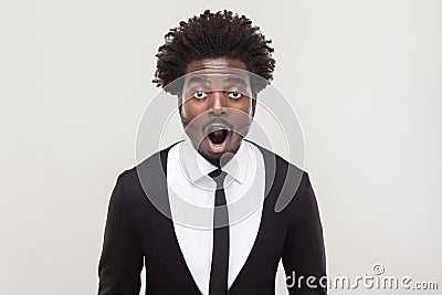 Amazement businessman looking at camera with shocked face. Stock Photo