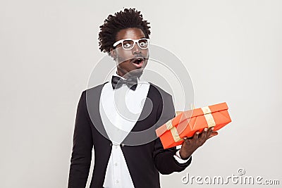 Amazement man holding gift box and shocked. Stock Photo