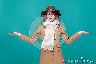 Amazement woman dressed in coat, hat and scarf. Stock Photo