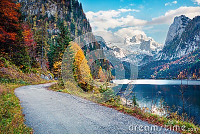 Amazing autumn scene of Vorderer / Gosausee lake with Dachstein glacieron background. Breathtaking morning view of Austrian Alps, Stock Photo