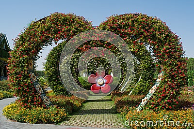 Amazing beautiful green hearts archway alley made from flowers in the garden Stock Photo