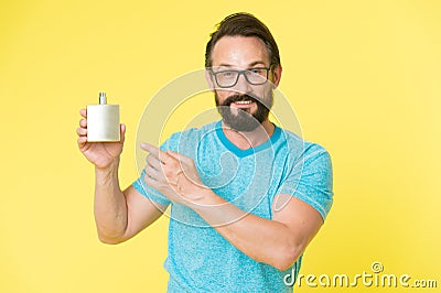 Amazing benefits of using perfumes. Man bearded handsome hold bottle perfume. How choose perfume for men according to Stock Photo