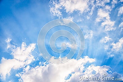 Amazing blue sky with fluffy clouds and sun rays. Beam of light, sky background Stock Photo