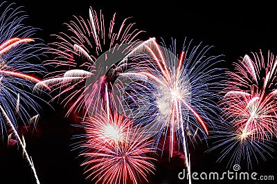 Amazing blue, white and red fireworks on dark background Stock Photo