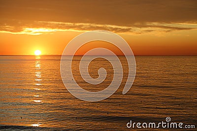 Amazing bright sunrise at the sea Stock Photo