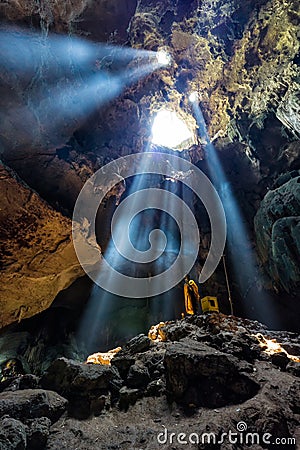 Amazing Buddhism with the ray of light in the cave, Ratchaburi P Stock Photo