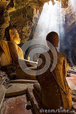 Amazing Buddhism with the ray of light in the cave Stock Photo