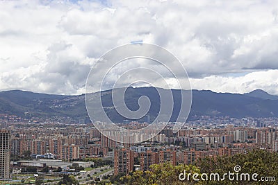 Amazing capture of a city landscape with modern residential buildings, mountains and blue cloudy sky at background Stock Photo