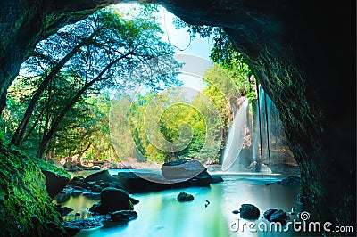 Amazing cave in deep forest with beautiful waterfalls background at Haew Suwat Waterfall in Khao Yai National Park Stock Photo