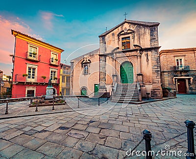 Amazing cityscape of Novara di Sicilia town with Chiesa di San Nicolo church. Colorful spring sunrise in Sicily, Italy, Europe. Be Stock Photo