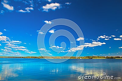 Amazing clear lake under blue sunny sky Stock Photo