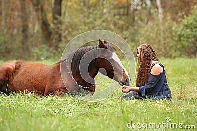 Amazing couple showing natural horsemanship Stock Photo