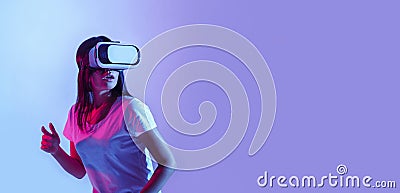 Amazing device. Shocked girl in virtual glasses consider digital world Stock Photo