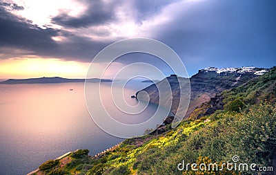 Amazing evening view of Fira, caldera, volcano of Santorini, Greece. Stock Photo