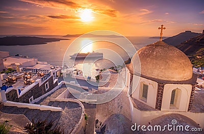 Amazing evening view of Fira, caldera, volcano of Santorini, Greece with cruise ships at sunset. Stock Photo