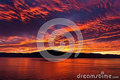 Amazing fiery burning evening sky Stock Photo