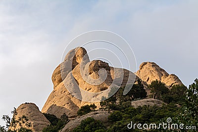 Amazing geological formations, strange-looking cliffs on sunset near Monastery of Montserrat, Spain Stock Photo