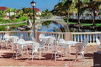 Amazing , gorgeous inviting view of Memories resort landscape, outdoor cafe, patio with metal vintage retro classic chairs Editorial Stock Photo