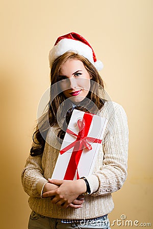 Amazing hipster girl in santa hat holding a Stock Photo