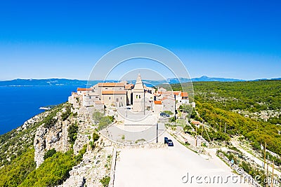 Town of Lubenice on the high cliff, Cres island in Croatia, Adriatic sea in background Stock Photo