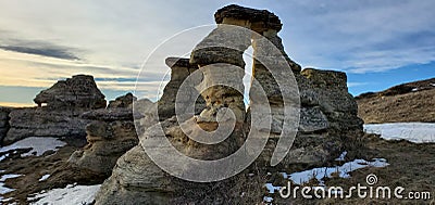 Amazing how the rocks below erode while still carrying the topper of the Hoodoo Stock Photo