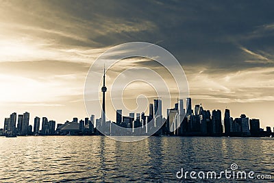 Amazing inviting natural landscape view of Toronto skyline, downtown area on dark golden sunset time background Editorial Stock Photo